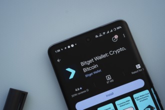 Dhaka, Bangladesh- 29 May 2025: On a blue surface, a smartphone displays the Bitget Wallet app