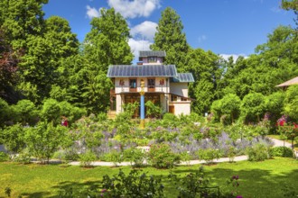 Rosarium with blooming roses in front of the Pompeian-Bavarian Casino on the Rose Island in Lake