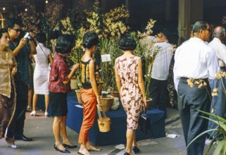 People attending flower show at the Singapore Turf Club, The 4th World Orchid Conference,