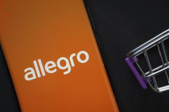 Dhaka, Bangladesh- 03 July 2025: A smartphone displaying the Allegro logo next to a miniature