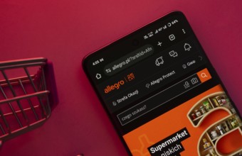 Dhaka, Bangladesh- 23 June 2025: A smartphone displaying the Allegro website with a shopping cart