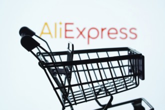 Dhaka, Bangladesh- 03 July 2025: Silhouette of a shopping cart in front of the AliExpress logo,