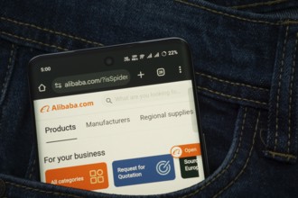 Dhaka, Bangladesh- 15 June 2025: A smartphone displaying the Alibaba web interface peeks out of a