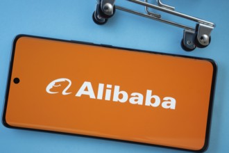 Dhaka, Bangladesh- 03 July 2025: Smartphone screen showing the Alibaba logo with shopping cart