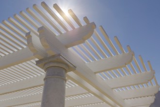 Detail abstract of A beautiful marble and wood pergola patio cover