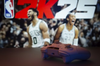Dhaka, Bangladesh- 03 July 2025: A close-up of a white gamepad with the NBA 2K25 seen on screen in