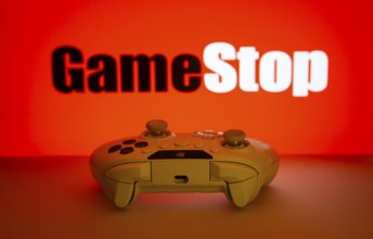 Dhaka, Bangladesh- 15 July 2025: Game controller in front of GameStop logo on a background