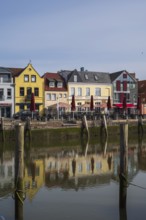 Building at the harbour, reflection, Husum, North Sea, North Frisia, Schleswig-Holstein, Germany