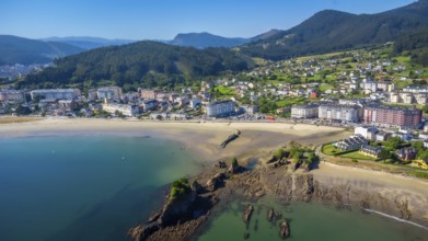 Aerial view of covas beach meeting the charming town of viveiro, nestled amidst the stunning