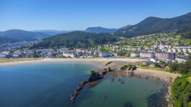 Aerial view of covas beach meeting the charming town of viveiro, nestled amidst the stunning