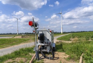 Mobile pump for artificial irrigation with a sprinkler system in a field where sugar beet is grown,