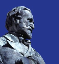 Verdi monument in front of Rocca dei Marchesi Pallavicino, now the city hall, with Teatro Giuseppe