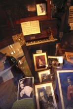 Shop window decoration in honor of Giuseppe Verdi, with pictures of opera Opera singer and