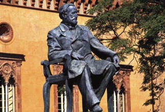 Verdi monument in front of Rocca dei Marchesi Pallavicino, now the city hall, with Teatro Giuseppe