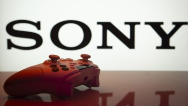 Dhaka, Bangladesh- 03 July 2025: Game controller in front of Sony logo on a background