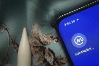 Dhaka, Bangladesh- 07 May 2025: Coinmarketcap app icon is seen on smartphone