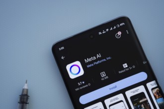 Dhaka, Bangladesh- 29 May 2025: On a blue surface, a smartphone displays the Meta AI app within the