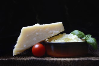 Parmesan cheese, grated cheese in rind and piece of Parmesan, Italy