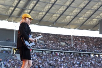 Angus Young, lead guitarist of AC/DC live on Power Up Tour 2025 at the Olympiastadion Berlin on 30