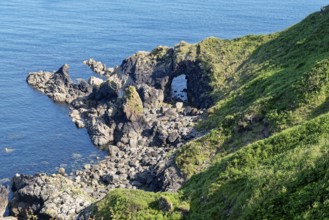 Rocky coast and rock gate on the south-east coast near the southern tip of Cornwall on the English