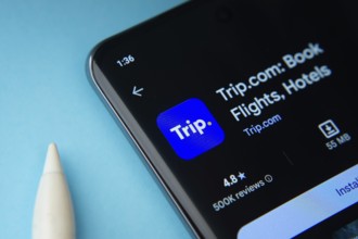 The trip.com app from Google Playstore is displayed on a smartphone screen