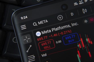 Meta stock trading app showing chart and data on smartphone screen