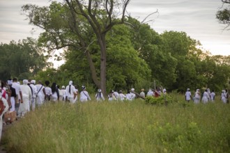 Detroit, Michigan - African-Americans gather on the banks of the Detroit River to commemorate
