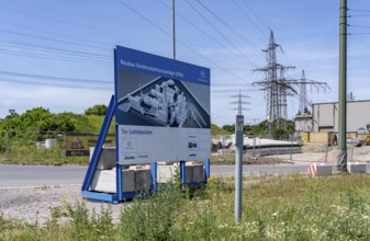 Construction site sign for thyssenkrupp Steel's first direct reduction plant, the climate-neutral