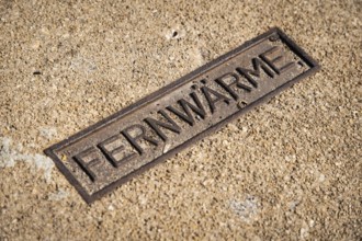 Sign for district heating on a manhole cover in Wuppertal, Germany