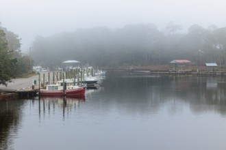 Private fishing boats in the harbor at Ocean Springs, Mississippi on a foggy morning