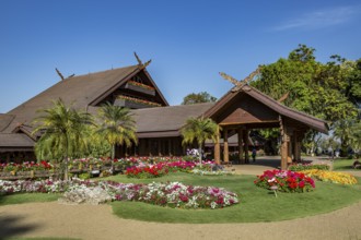 Ornate trees and lush flower gardens enhance the Lanna and Swiss architecture of the Doi Tung Royal