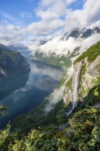 Gjerdefossen waterfall, at Ørnesvingen viewpoint, atmospheric clouds over the fjord in the morning