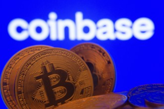 Dhaka, Bangladesh- 16 June 2025: Close-up of Bitcoin coins with the Coinbase logo visible on a