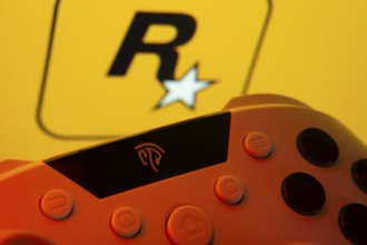 Dhaka, Bangladesh- 12 June 2025: A close-up of a gamepad with the rockstar games seen on screen in