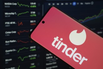 Dhaka, Bangladesh- 18 March 2025: tinder logo is displayed on a smartphone screen, with a stock
