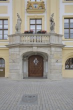 Portal with town coat of arms, figures and decorations from the baroque town hall, market square,