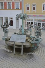 City fountain by Bonifatius Stirnberg 2000, bronze sculptures on the historical city history with