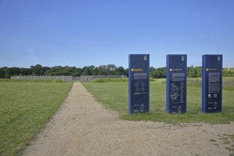 Information board with information on the solar observatory, archaeological reconstruction from the