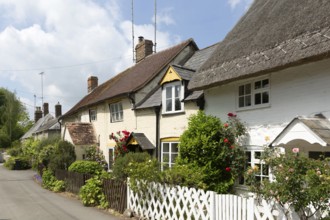 Attractive historic cottages in village of Avebury, Wiltshire, England, UK