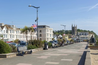 Seafront promenade view east towards St Michael's church, Teignmouth, south Devon, England, UK