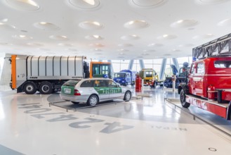 Gallery of helpers with rescue and police vehicles. The Mercedes-Benz Museum in Stuttgart presents