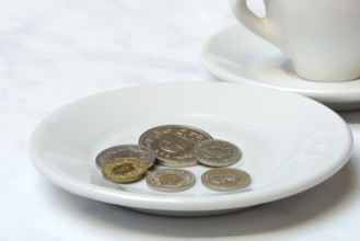 Tip, Swiss coins on plate, Switzerland