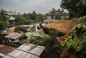 Damaged houses after a major landslide, triggered by a heavy downpour, in Guwahati, India, on June