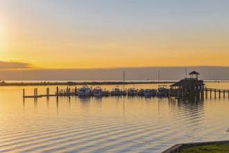 Biloxi Schooner Pier Complex at sunset on the Gulf of Mexico at Biloxi, Mississippi, USA