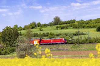 RegionalExpress RE5 en route on the Swabian Alb. Landscape along the railway line in spring.