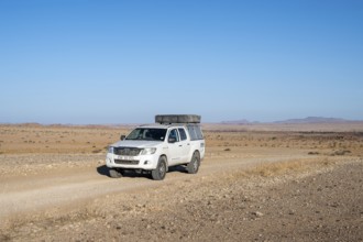 Off-road car on a sandy track, Brandberg, Damaraland, Namibia
