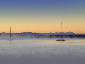 Evening atmosphere, sailing boats in the fog on Lake Starnberg, Zugspitze massif in the background,