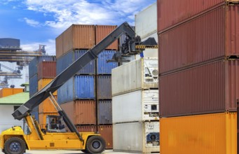 Busy international industrial port with freight and shipment docks and cargo containers