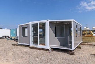 Foldable tiny house container kit home partially unfolded at Botel Campground near Savannah,