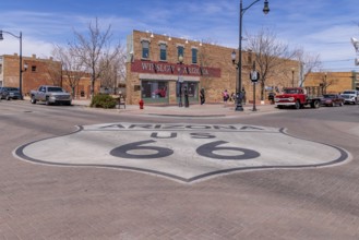 Tourists take photos Standin' on a Corner in Winslow Arizona as sung in the classic Glenn Frey and